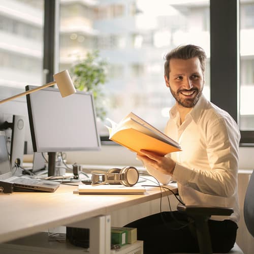 pexels-photo-927022-927022 A relaxed businessman enjoying a break in his bright, contemporary office environment.